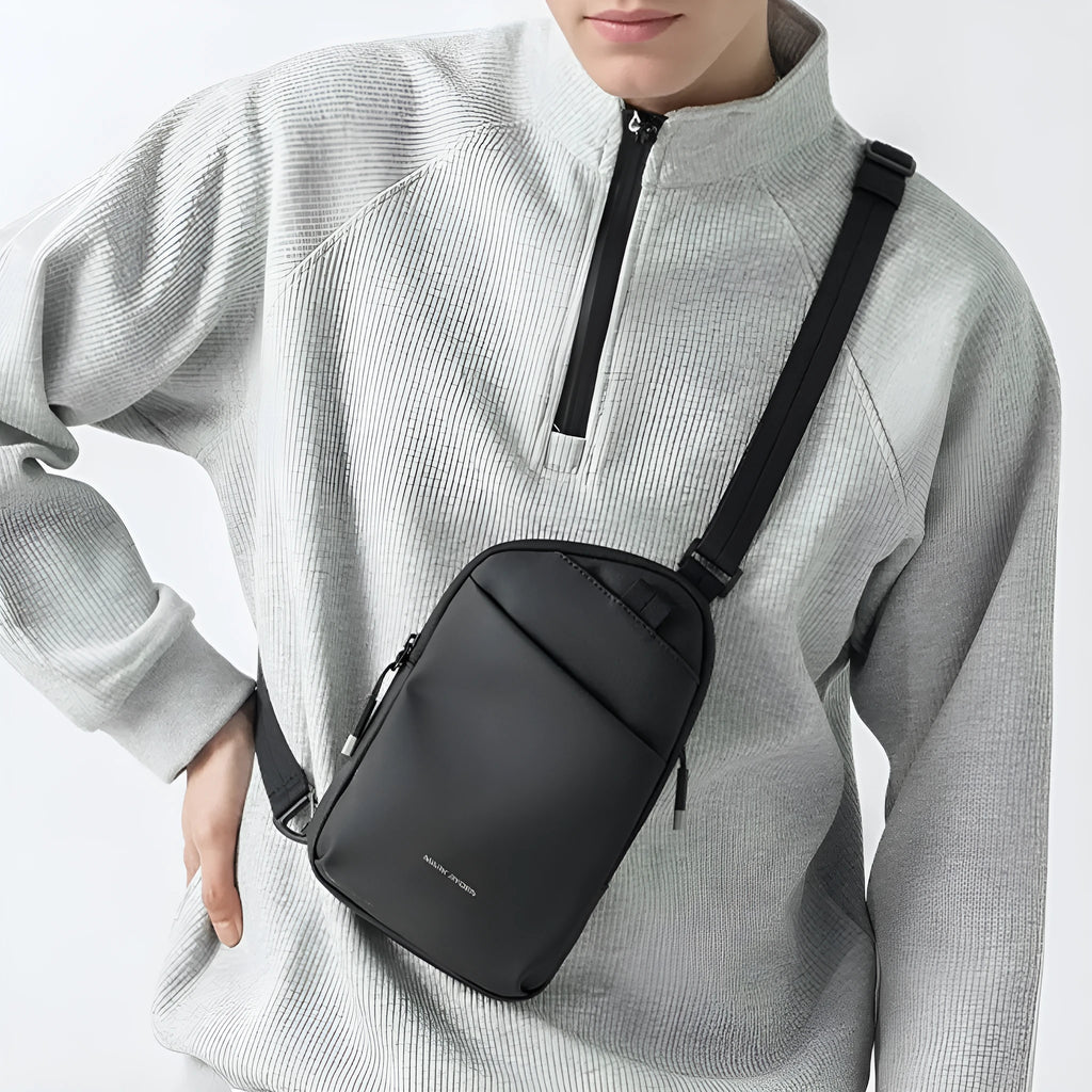 Men's elegant black lightweight crossbody bag made from Oxford cloth with visible stitching.