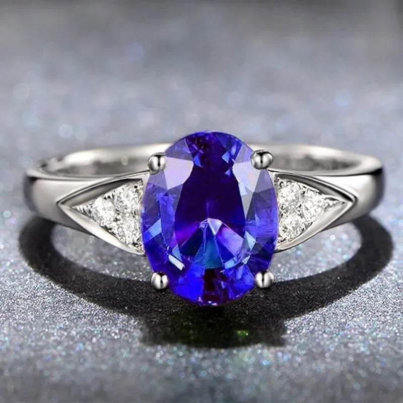 Women's court-style fashion ring with a choice of heart, water drop, or bell pattern inlaid with a natural zircon stone.