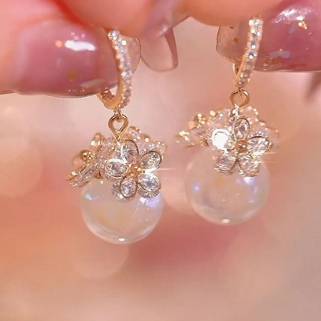Close-up of a women's geometric rose design zircon earring with an electroplated finish.