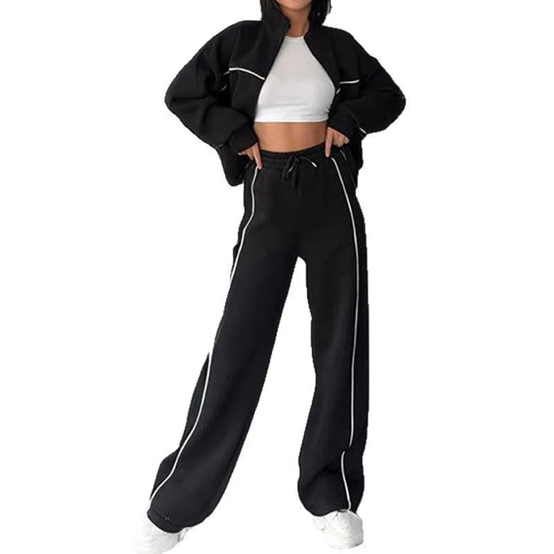 Casual two-piece suit set with a mock neck zip hoodie and striped trousers on a hanger.