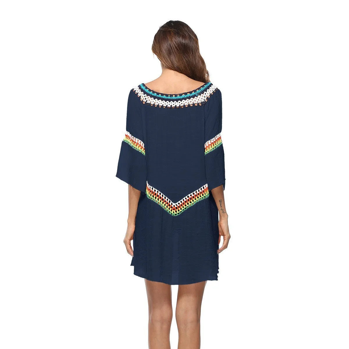 Crocheted ethnic style women's beach cover-up in acrylic fabric for sun protection.
