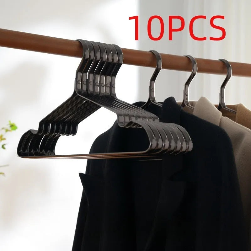 Modern elegant black non-slip clothes hanger on a white background.