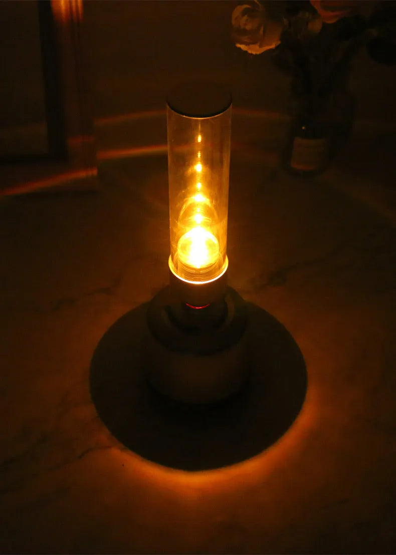 White silver Bluetooth speaker with candlelight night light showing push button controls and modern simple design