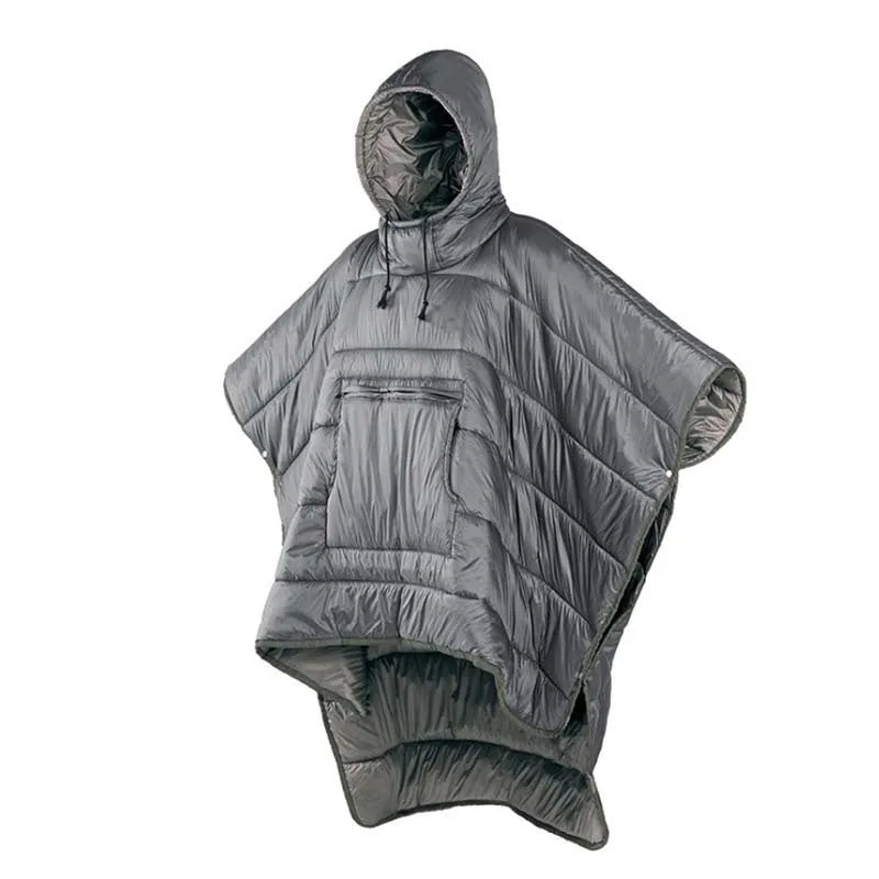 Adult wearing a grey outdoor cloak sleeping bag, showing its full 200x140cm size and hood.