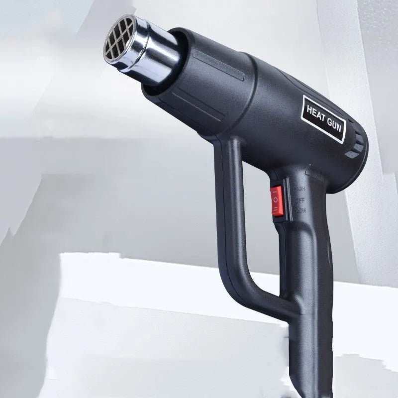 2000W industrial hot air gun with grid air outlet and two-gear temperature switch.