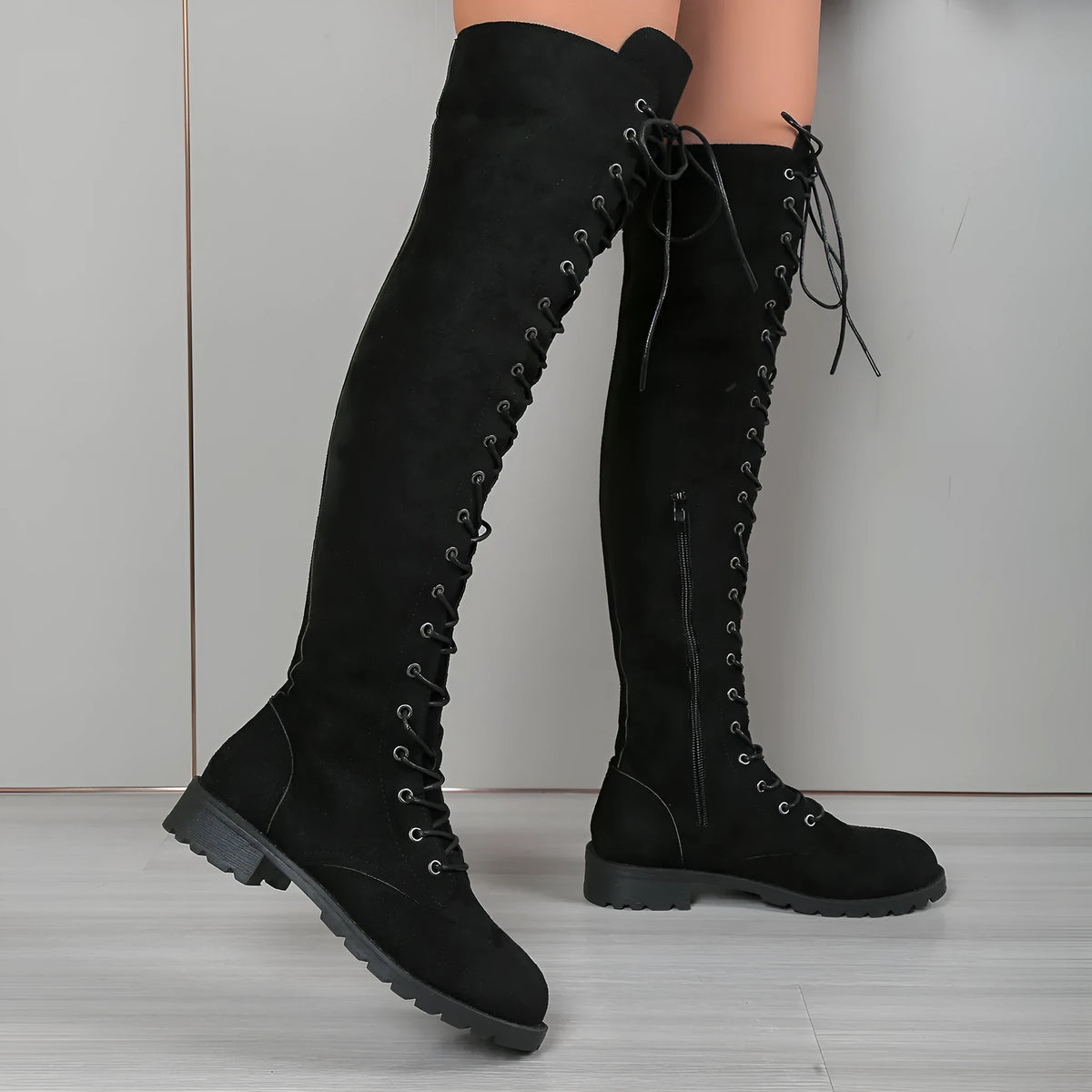 Women's black lace-up over-the-knee boots with round toe and side lacing detail