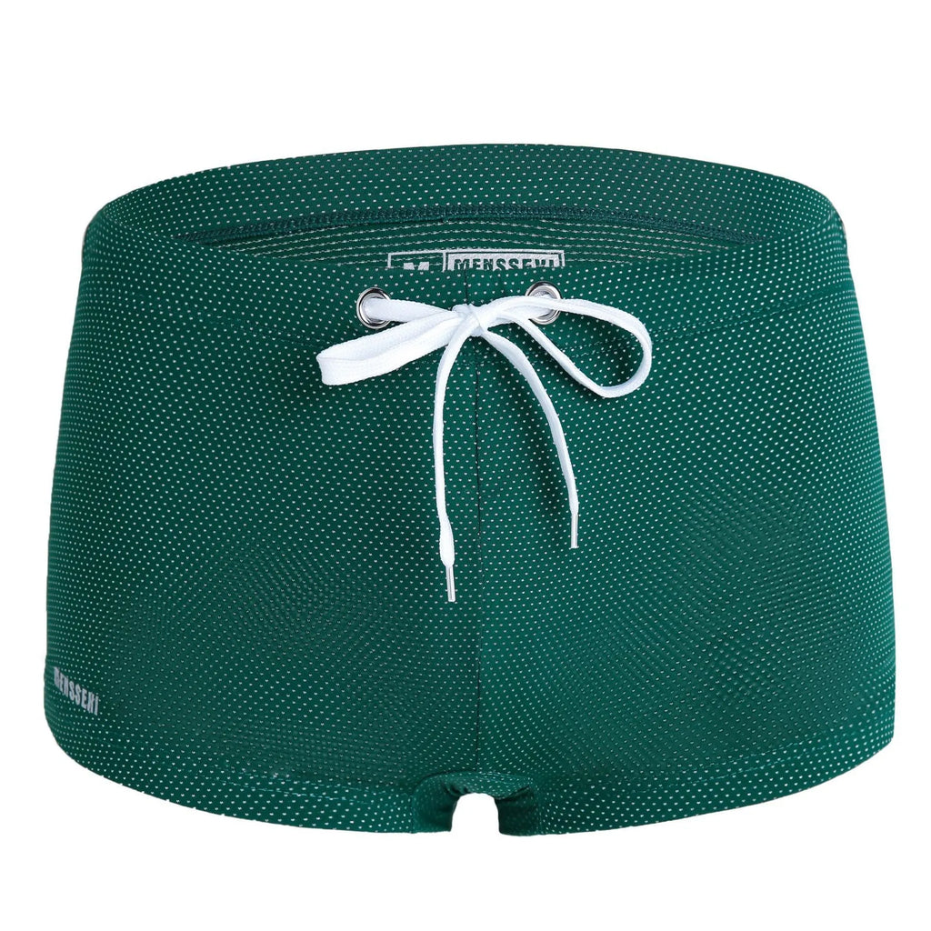 Men's solid colour low waist nylon swimming trunks with lace detail.
