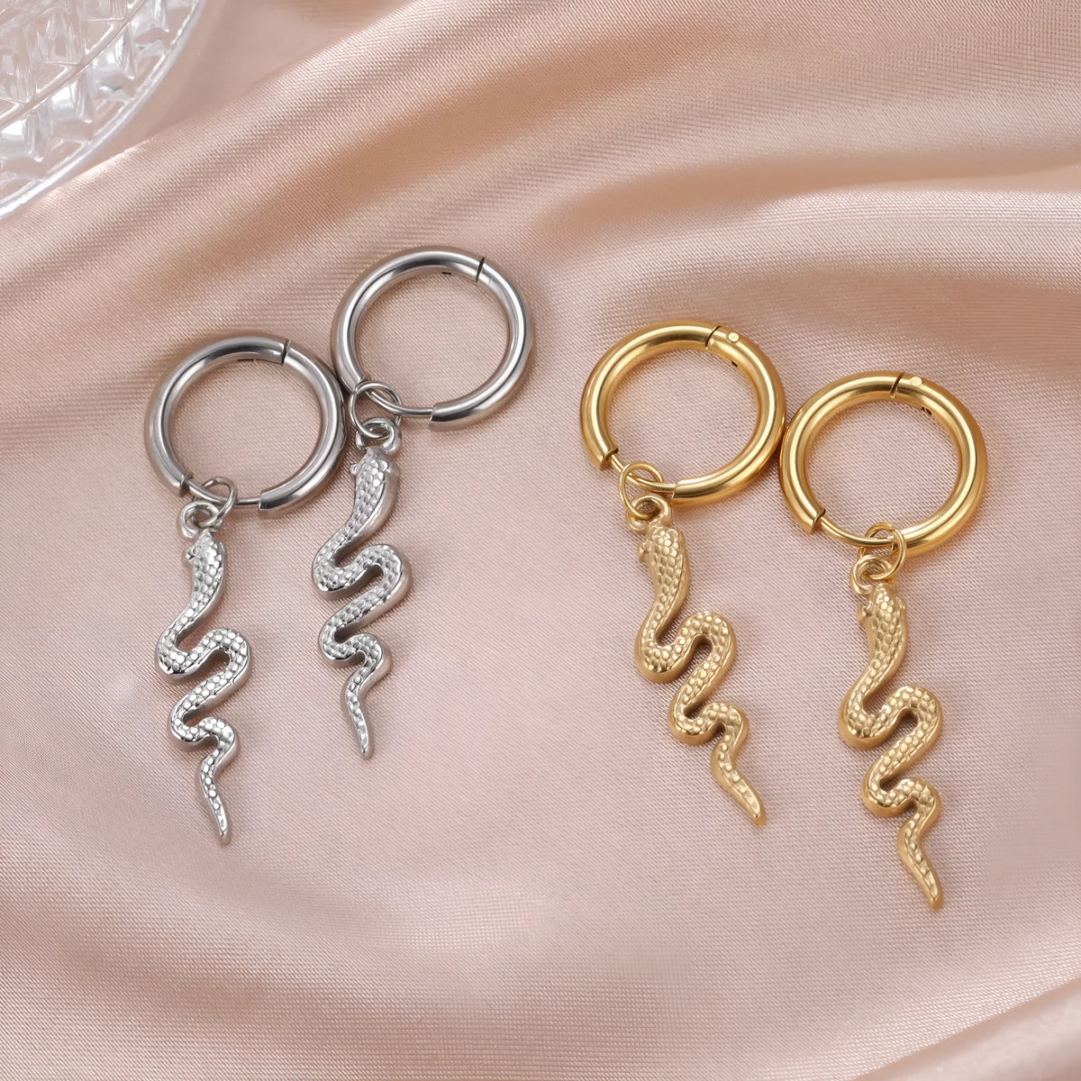 Gold or steel coloured stainless steel snake-shaped vintage clip-on earrings