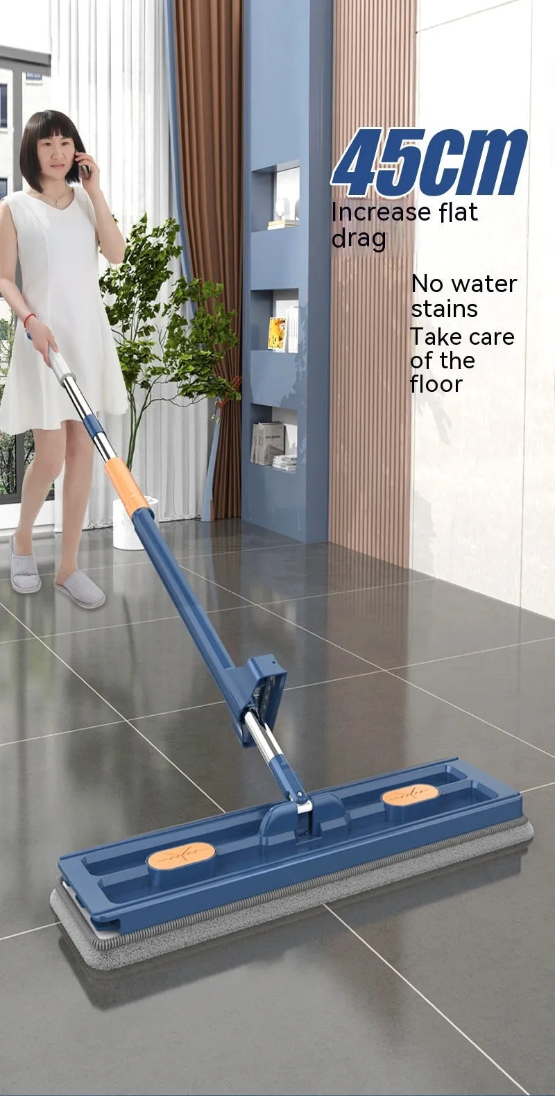 Large blue flat mop with long stainless steel handle and 360-degree rotating head on a hard floor