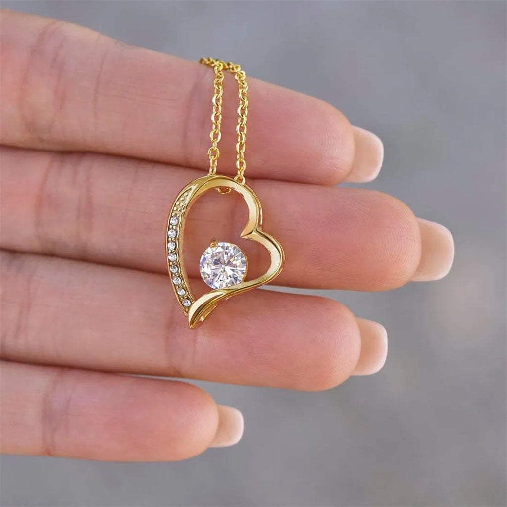 Heart-shaped necklace in gold or silver with gift box and card.