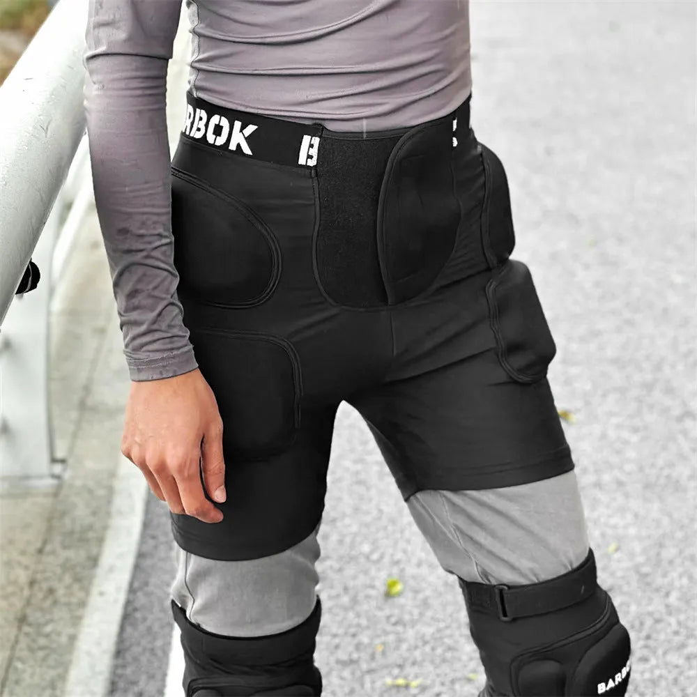 Black BA103 protective hip pad with elastic leg straps for roller skating and skateboarding safety.