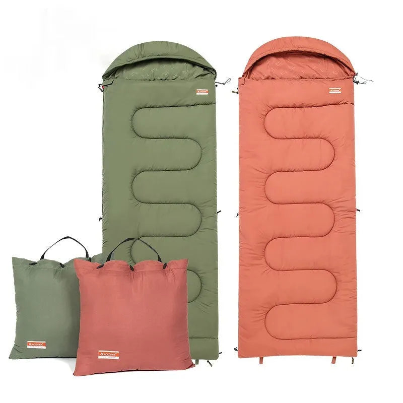 Ochre and olive green cotton sleeping bag quilt for outdoor camping, folded to show portable design.