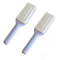 Self-cleaning hair brush in Roland purple colour showing rotate handle mechanism and bristle design