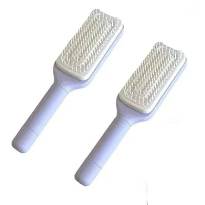 Self-cleaning hair brush in Roland purple colour showing rotate handle mechanism and bristle design