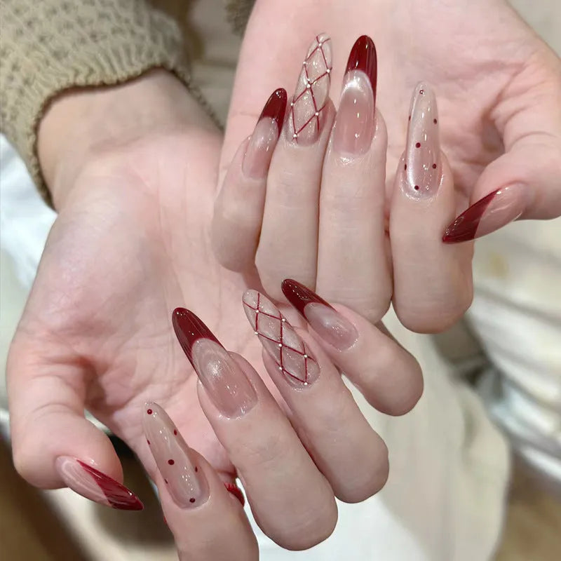 Glossy false nails with transparent pink French tip design showing 10 complete sets