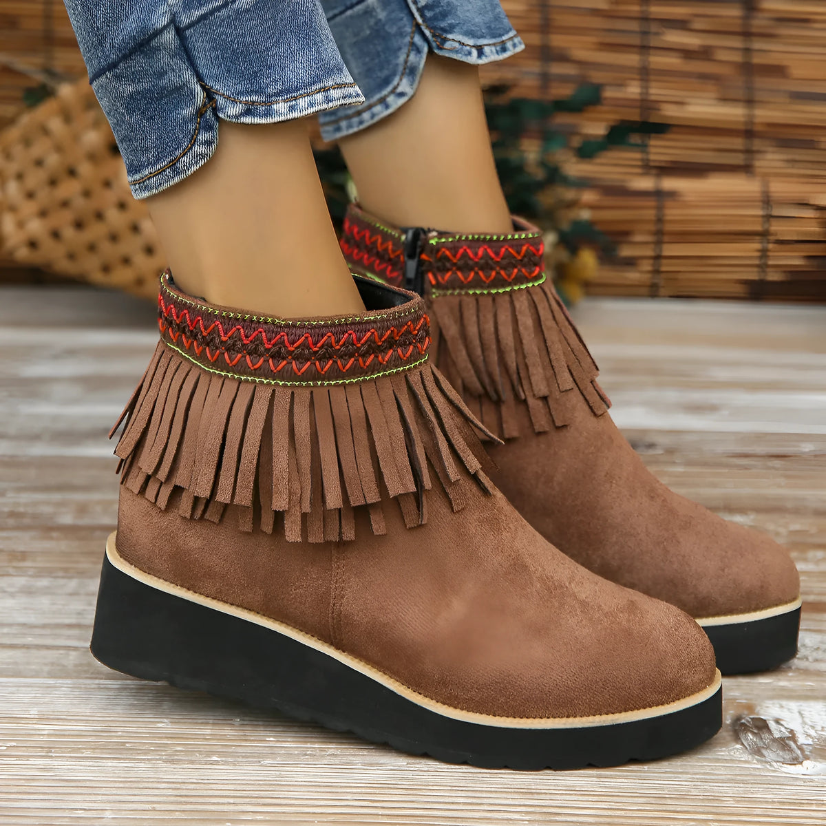 Women's dark brown suede wedge ankle boots with side zip, waterproof platform, and tassel detail.