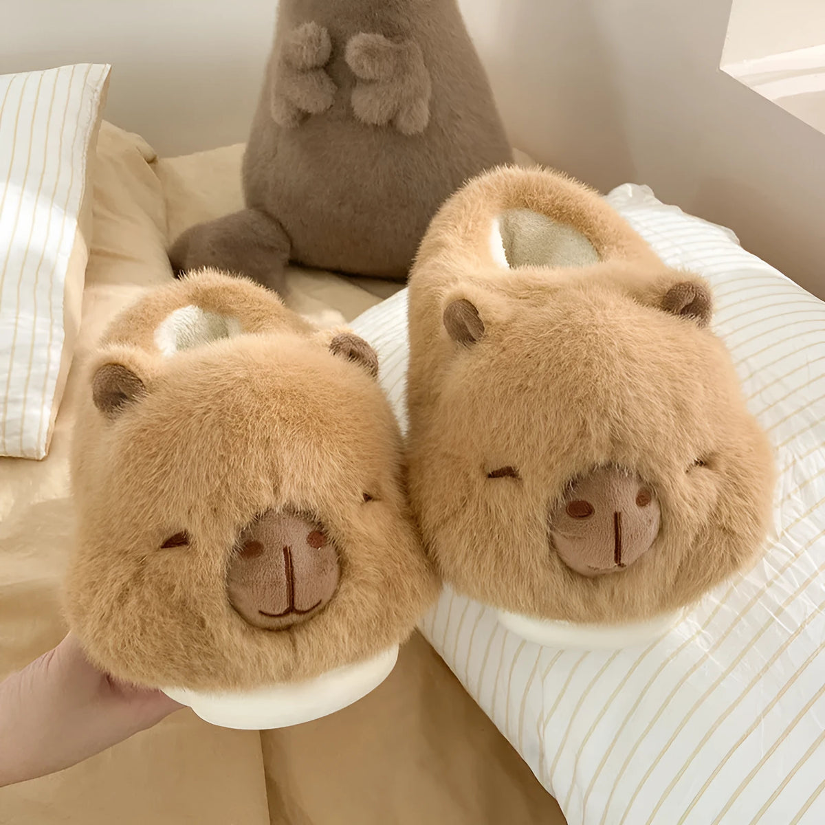 Light brown women's winter slippers with plush upper, artificial wool lining, and slip-on design