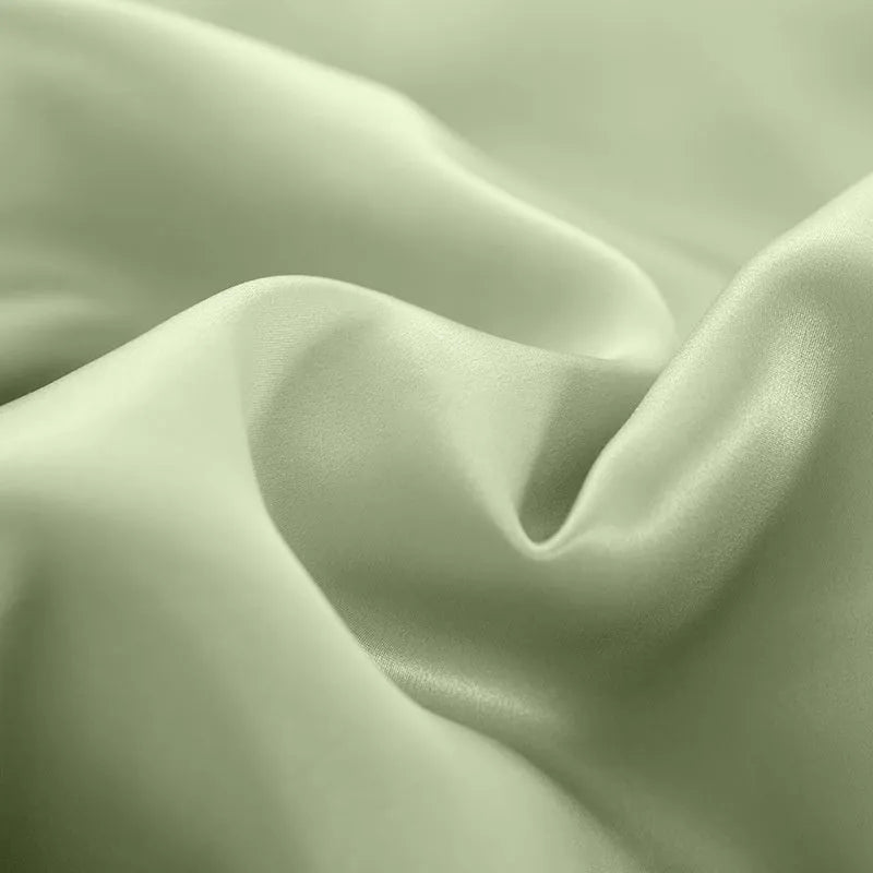 Solid colour double-sided silk duvet cover shown in bright brown, with other colour options available.
