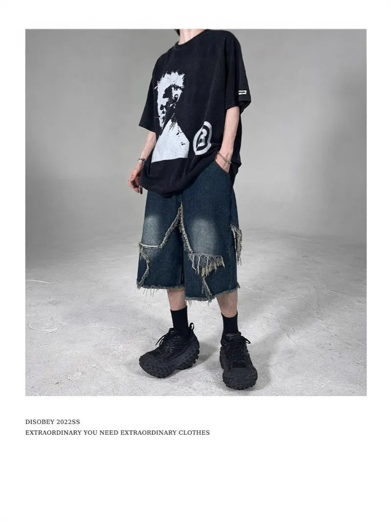 Blue denim shorts with frayed five-pointed star design, loose fit, shown from front view