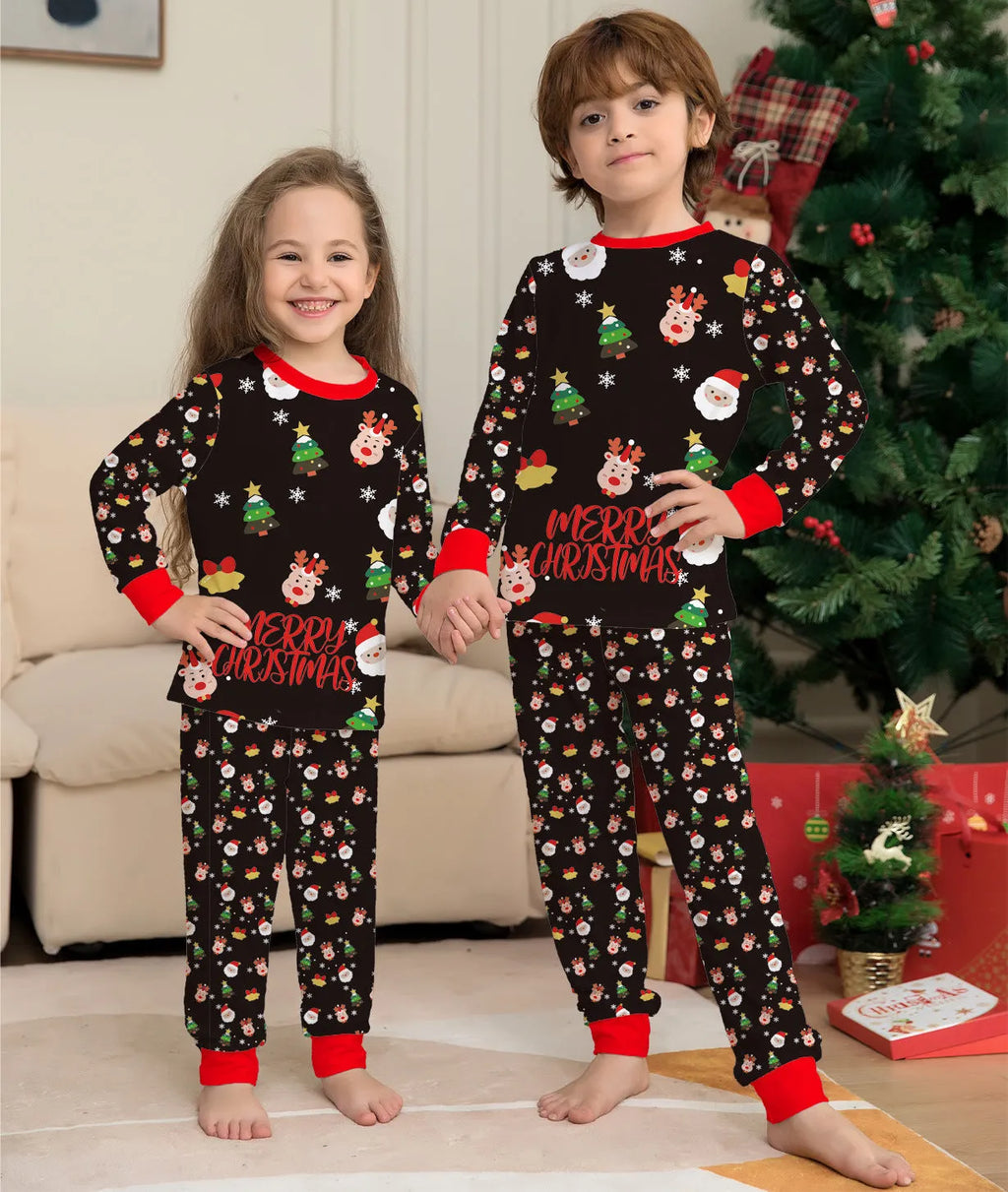 Family wearing matching Christmas pyjamas with plaid and cartoon prints, including parents, children and dog