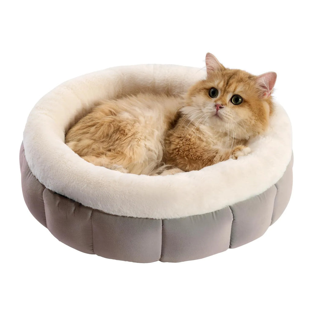 Round donut dog and cat bed in faux rabbit fur with anti-slip bottom and raised sides, available in five sizes
