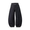 Men's original cow colour wide leg denim trousers on a mid-waist model.