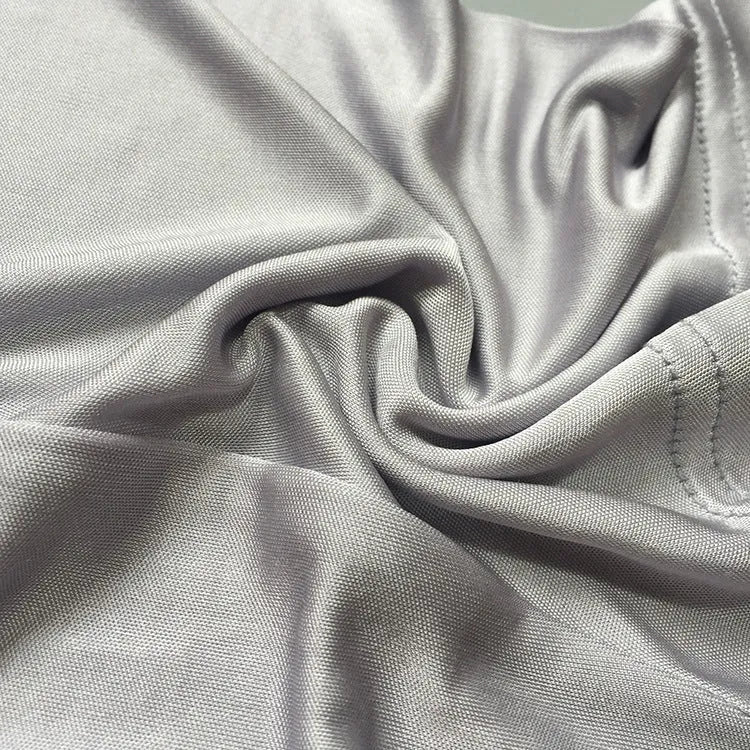 Men's loose silk shorts in navy blue, silver gray, and skin color with mid-waist design