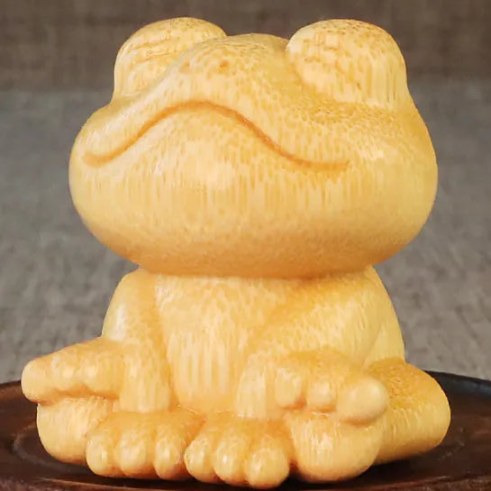 Solid bamboo carving ornament with cartoon smiling frog design, measuring 5cm high