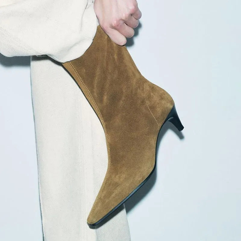 Women's brown square toe mid-calf boots with side zipper and retro kitten heel on wooden floor