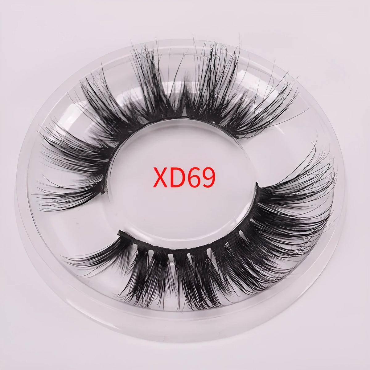 5D mink false eyelashes set with application brush and storage cap on white background