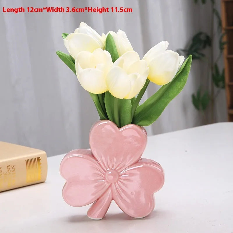 White porcelain clover-shaped ceramic vase in light green, pink, red, or white colours.