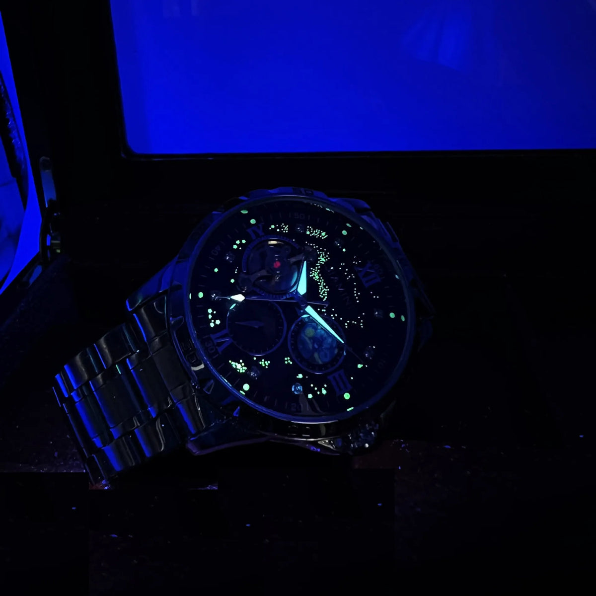 Automatic mechanical men's watch with rose gold shell and black dial showing large multifunctional display