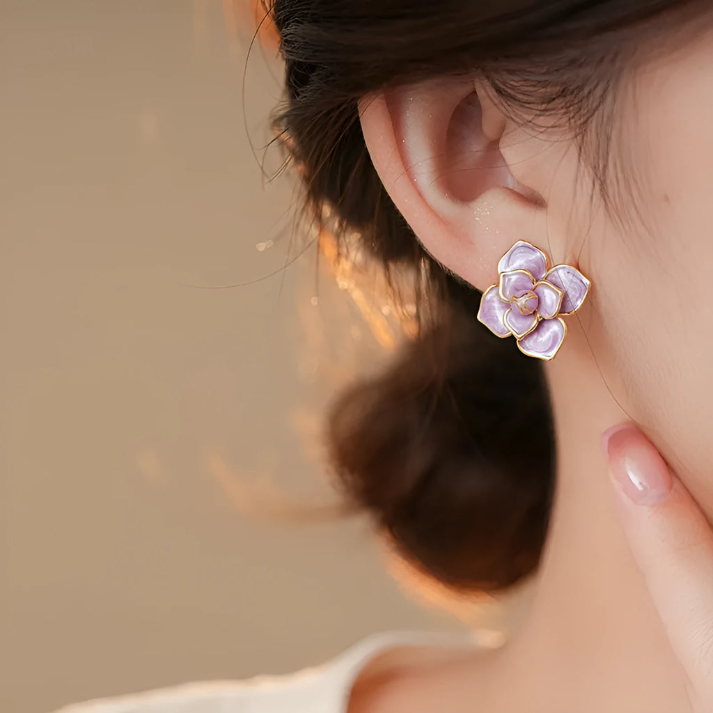 Gold plated purple oil-spot glaze flower stud earrings on copper base with floral design