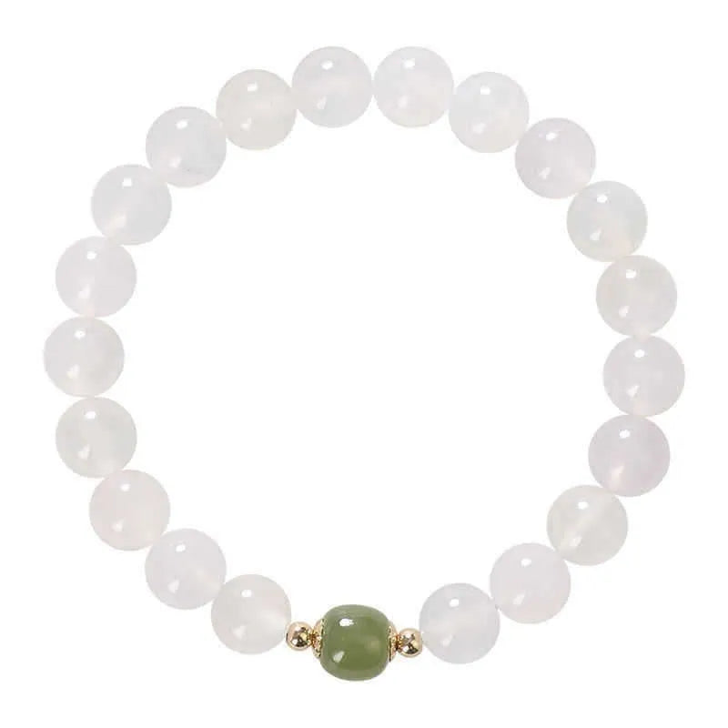 Handmade white agate and Hetian jade bracelet with red cinnabar inlay and a text charm.