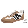 Women's retro lace-up jogging shoes in black, grey, and khaki colours showing round toe and platform heel.