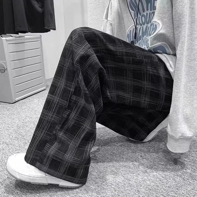 Black and green plaid casual trousers with straight-leg cut and mid-waist design