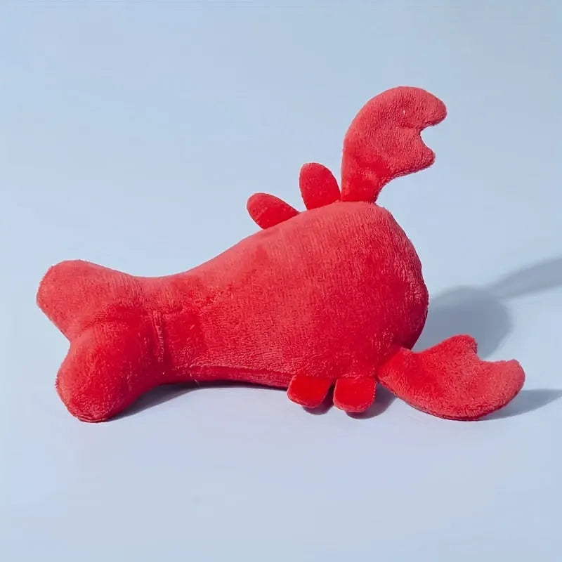 Red lobster stuffed squeaky dog toy for small and medium breeds on white background