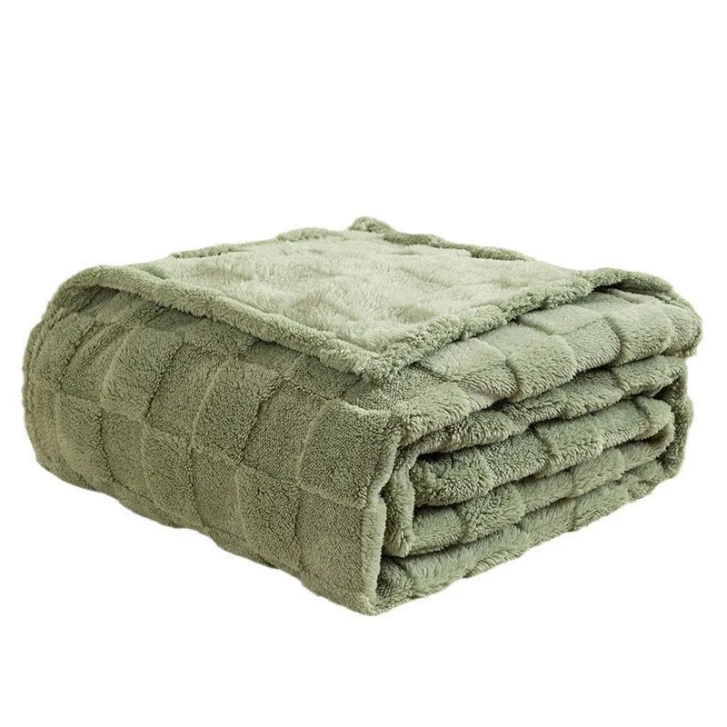 Geometric pattern polyester blanket in milky white colour on grey sofa