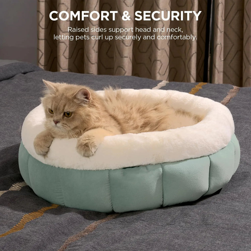 Round donut dog and cat bed in faux rabbit fur with anti-slip bottom and raised sides, available in five sizes