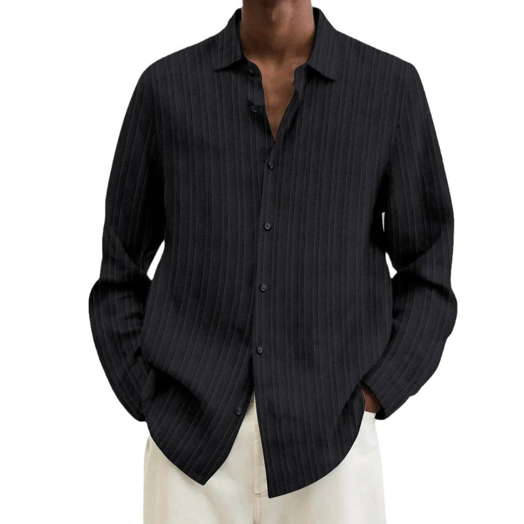 Man wearing a British-style striped cardigan with long sleeves and a loose fit
