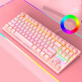 Black and white mechanical gaming keyboard with coloured key options on a desk.