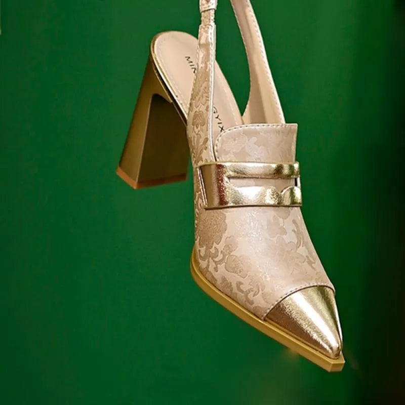 Women's black chunky heel pointed-toe sandals with a high-cut ankle strap.