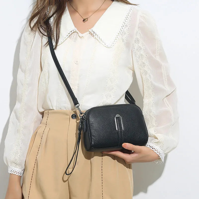 Genuine leather women's shoulder bag in a horizontal square shape, shown in black colour.