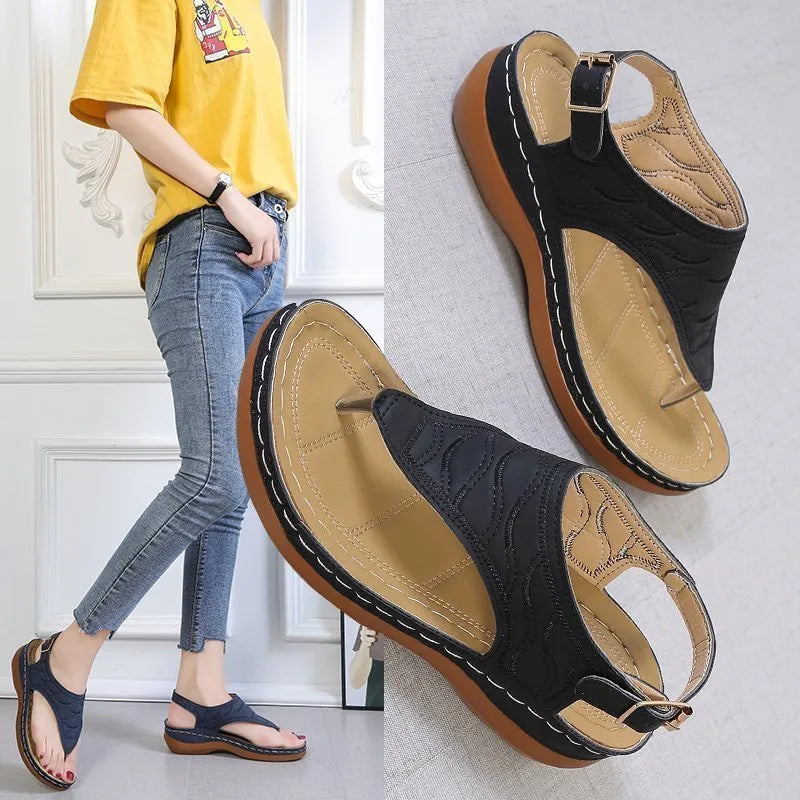 Women's casual wedge heel sandals with an adjustable buckle strap in red.
