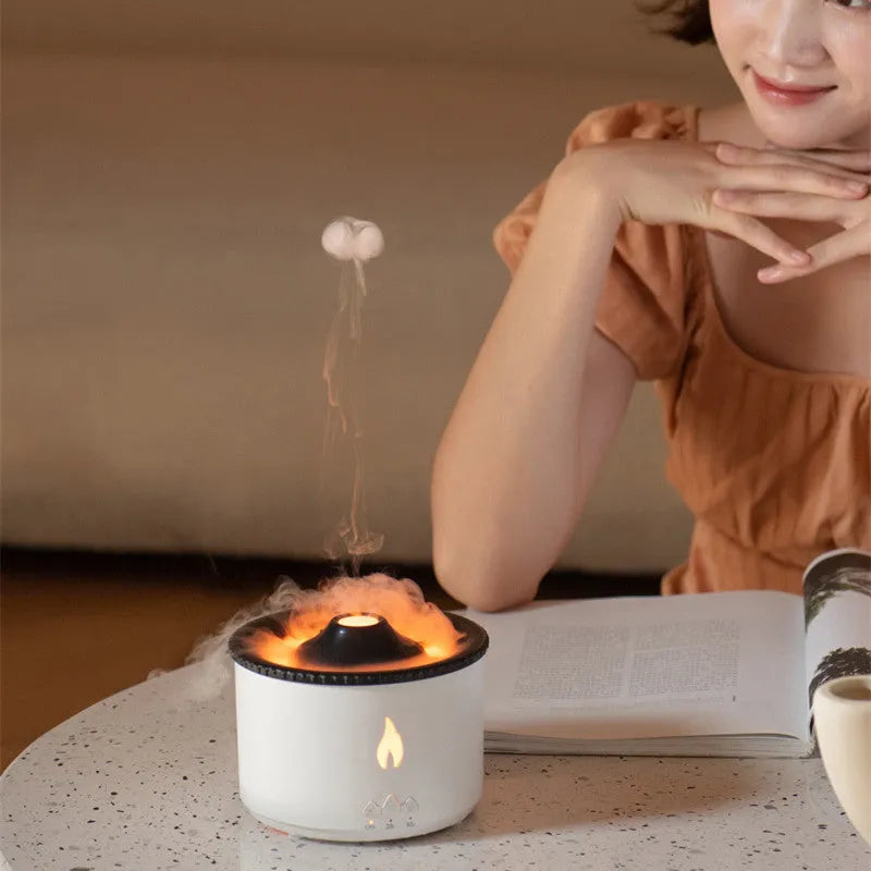Volcano-shaped humidifier emitting a two-colour mist ring on a table.