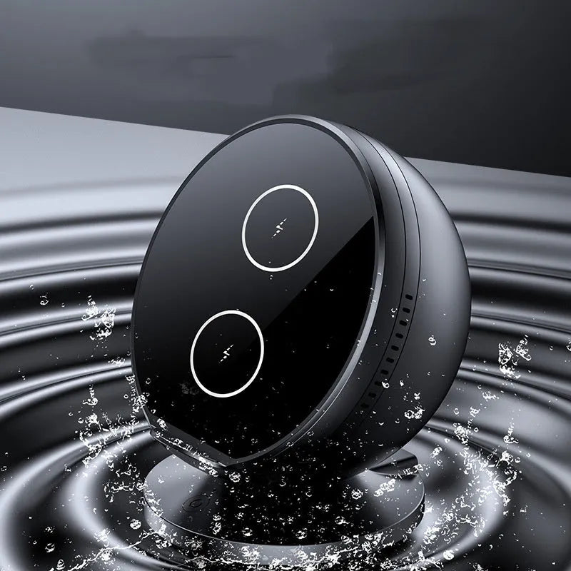 Black multifunctional wireless charging phone holder with integrated Bluetooth speaker on a desk