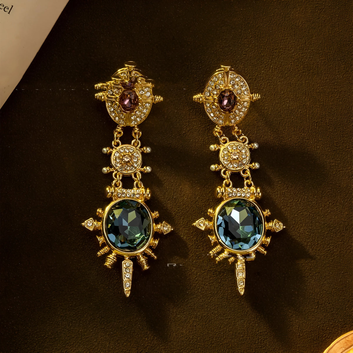 A pair of gold retro-style stud earrings with a geometry and round shape.