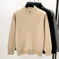 Men's black knitted zip cardigan with stand collar showing loose fit and thickened fabric texture