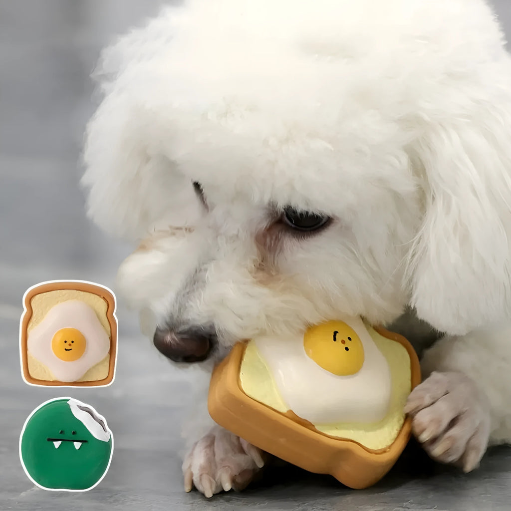 Yellow and green cartoon egg bread shaped latex squeaky toy for dogs on a white background.