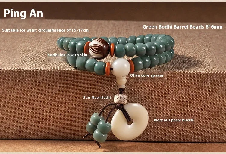 White jade and green sandalwood beaded bracelet with a double ring lotus safety buckle clasp.